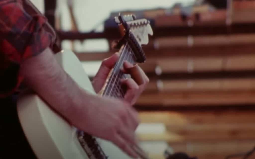 Rory Gallagher using a Bill Russel Elastic Capo during Isle of Wight Festival in August 1970.