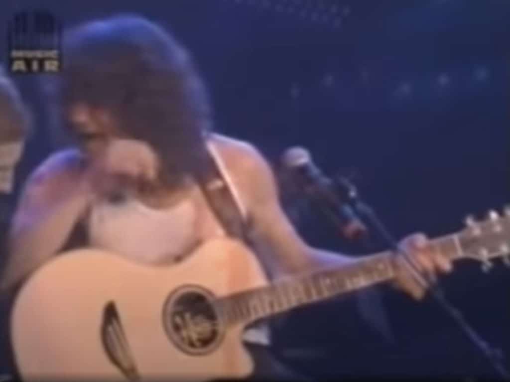 Eddie Van Halen playing an acoustic guitar, Sydney, Australia 1998.