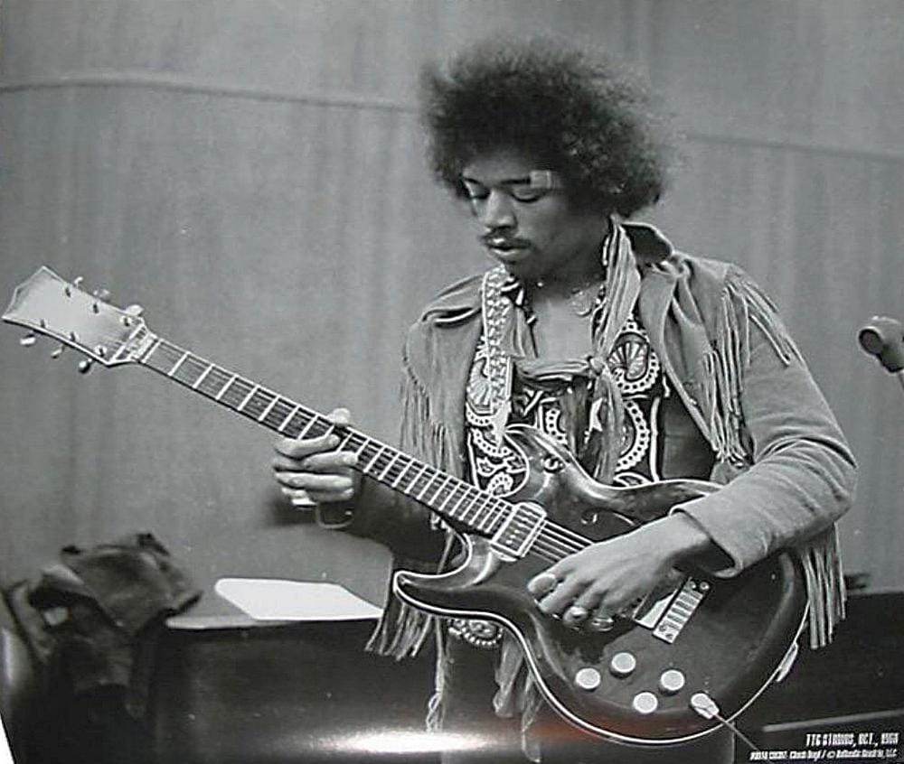 Jimi Hendrix playing a rare Bartell Black Widow guitar during a rehearsal in 1970