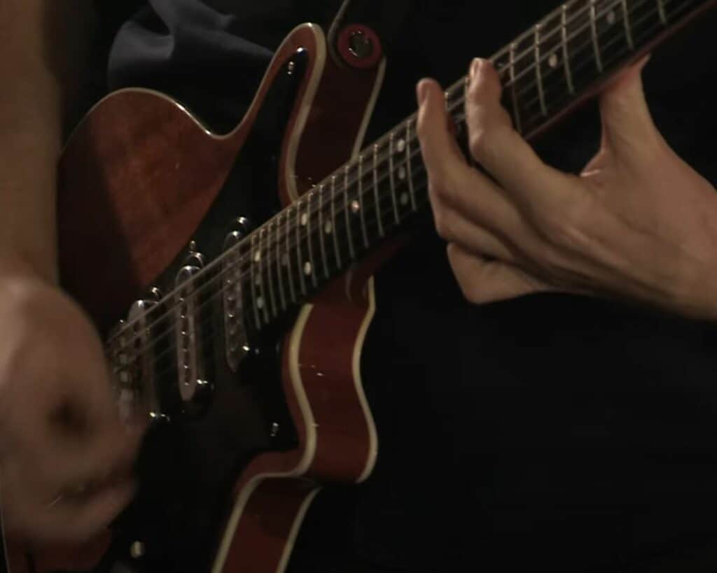 Brian playing the replica nicknamed "John". Notice how "fresh" the pickup covers and the finish looks.