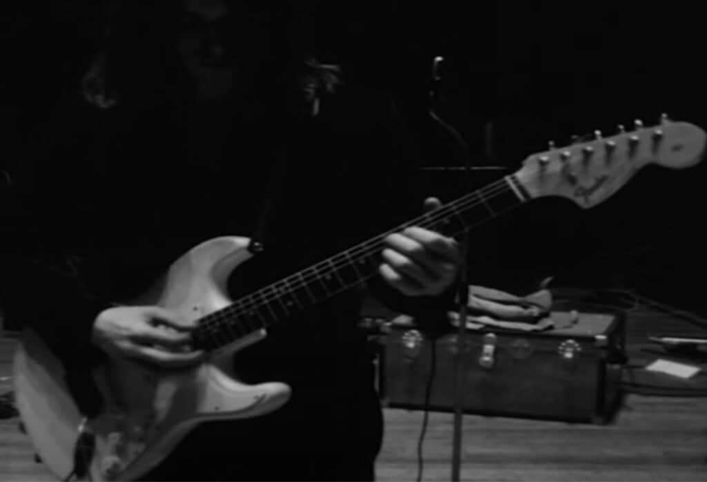 Another photo of David's white Stratocaster showing the large headstock. 