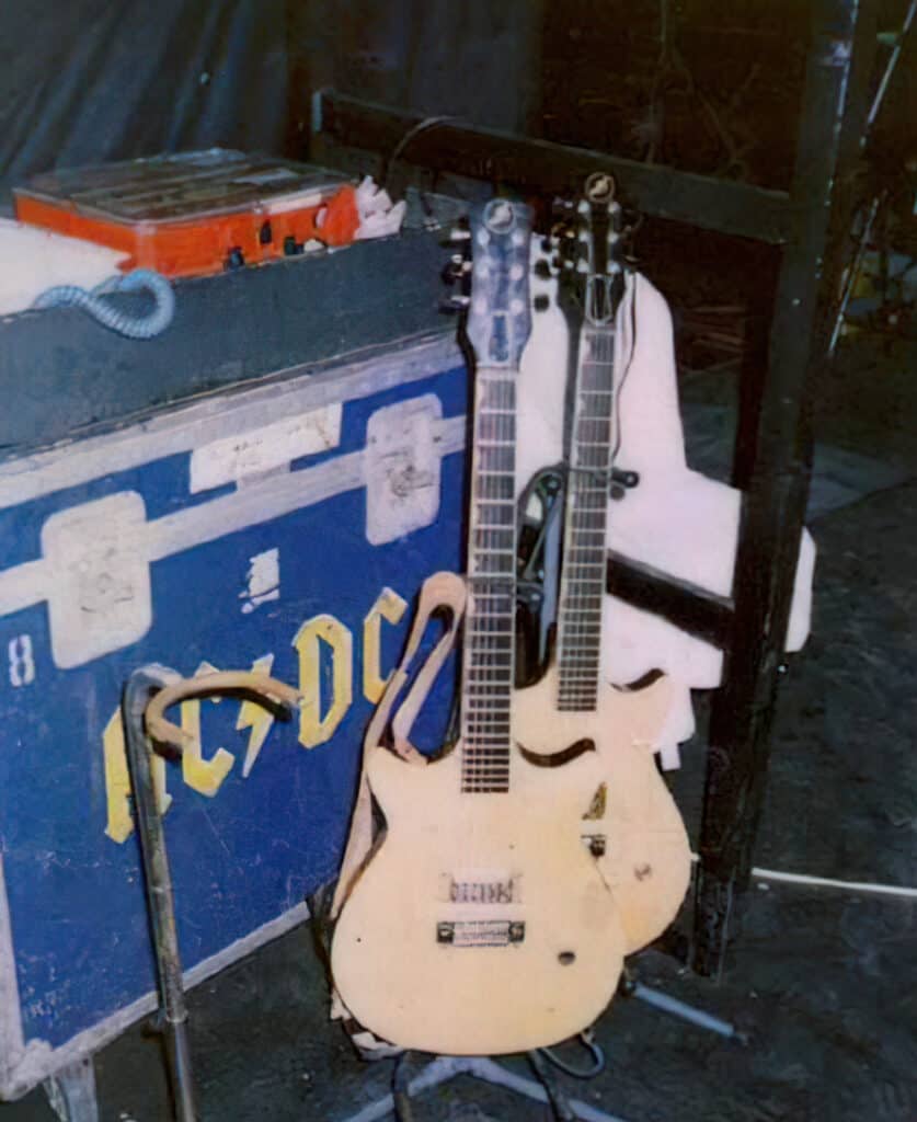 Malcolm's Jaydee guitars pictured on a stage. 