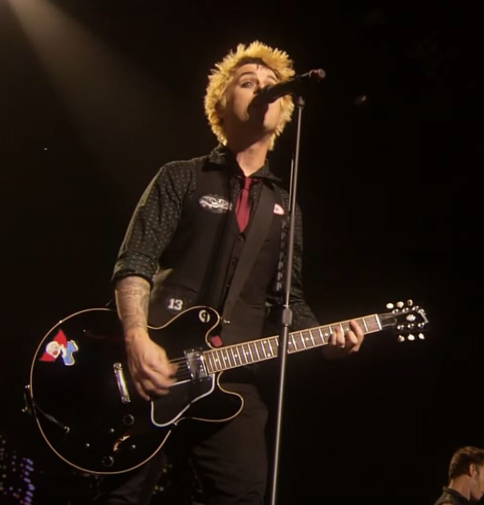 Billie seen playing a black ES-335 with a clown sticker in 2009. 