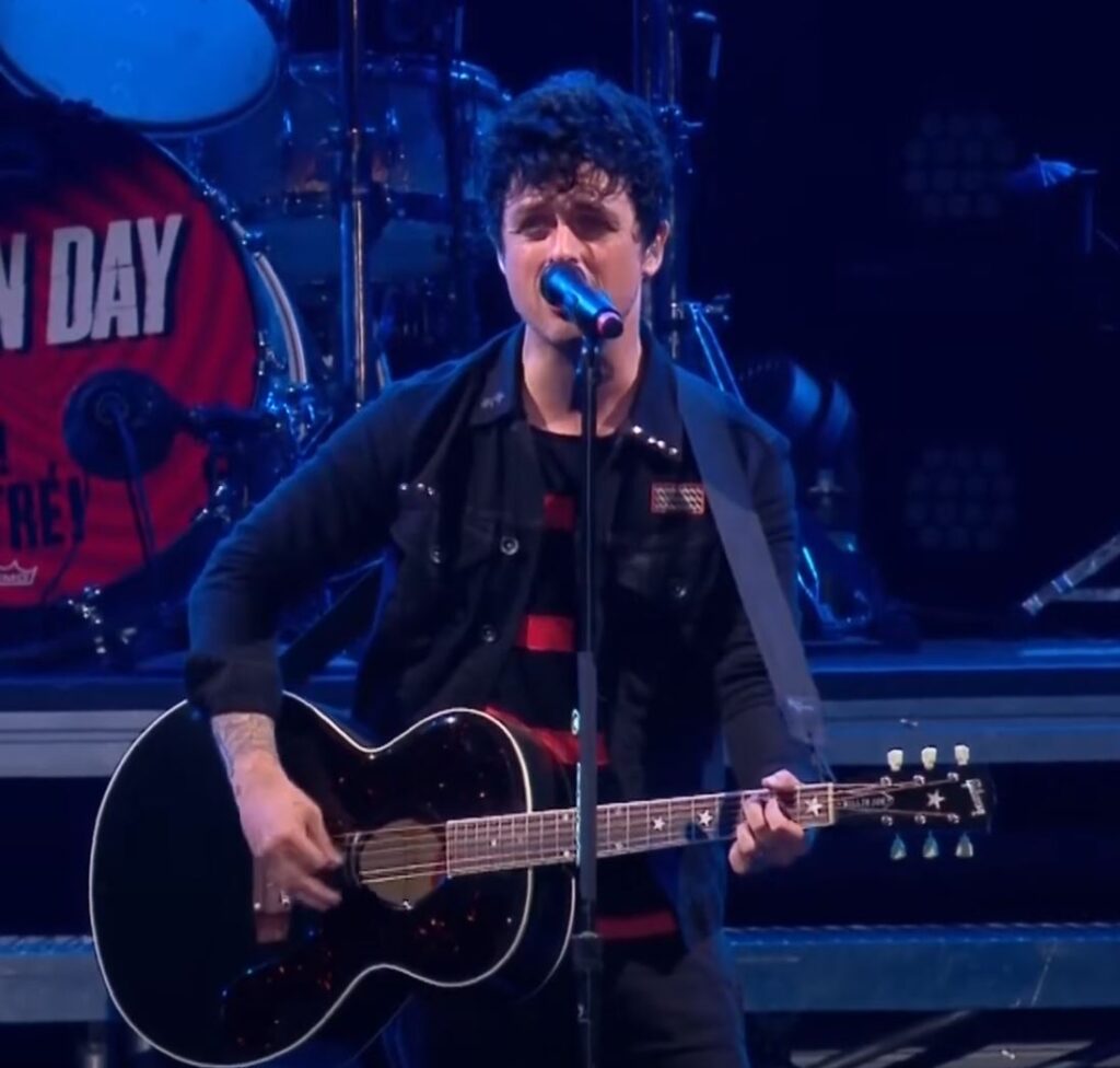 Billie playing his signature J-180 Gibson at the 2013 Reading Festival. 