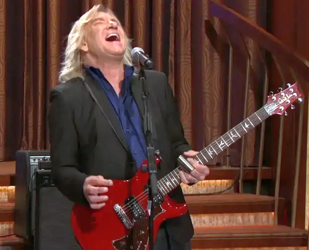 Joe Walsh playing the 2007 PRS Mira in Vintage Mahogany finish during Rocky Mountain Way on Conan in 2016
